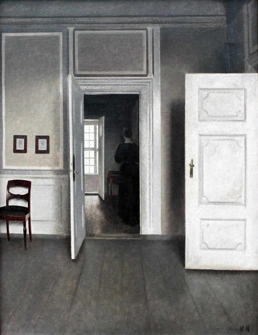 Hammershøi, Interior, Strandgade 30: through an open door, another room and a figure seen from behind.